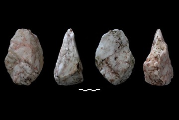 Four Early Stone Age axes discovered by a US-Greek team of archaeologists on the southern island of Crete. A ministry statement said Monday that these and other similar finds, dating back at least 130,000 years, point to what may be one of the earliest signs of human seafaring. AP Photo/Greek Culture Ministry.