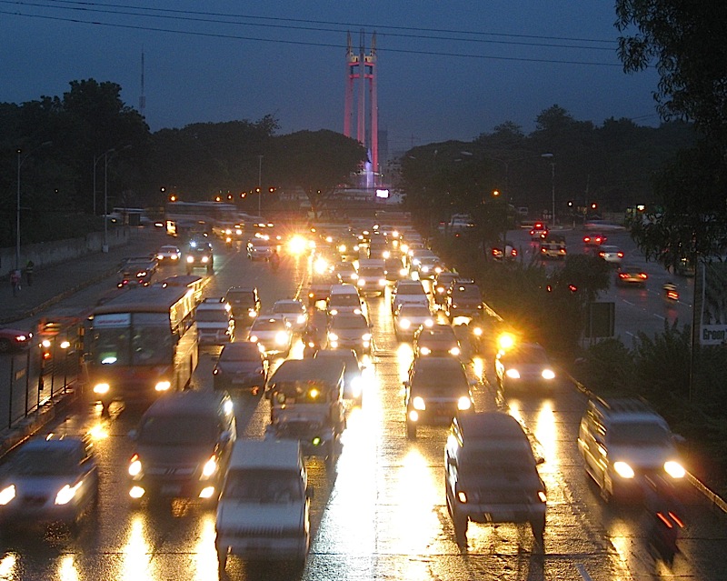 the fountain and monument of the Quezon Memorial with colored lights for Noynoy Aquino's inaugural street party