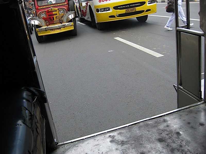 looking at the street from inside a jeepney