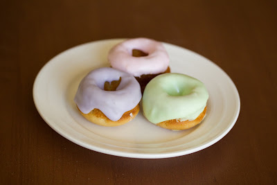 photo of three Frosted mini sugar donuts on a plate