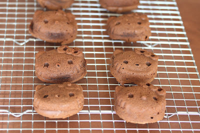 photo of hello kitty chocolate mochi on a baking rack