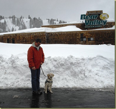 Tony and Reyna standing out front of Bear Valley Ski Resort.  The Bear Valley Ski Resort sign is in the back ground
