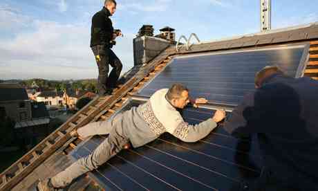 Technicians implement a solar row for prohibited H2O on the roof tiles of a house