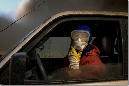 Wearing a mask and goggles to protect against the smoke, dairy farmer Berglind Hilmarsdottir from Nupur, Iceland, looks for cattle lost in ash clouds, Saturday, April 17, 2010. (AP Photo/Brynjar Gauti) #
