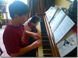 boy-and-dog-practising-piano