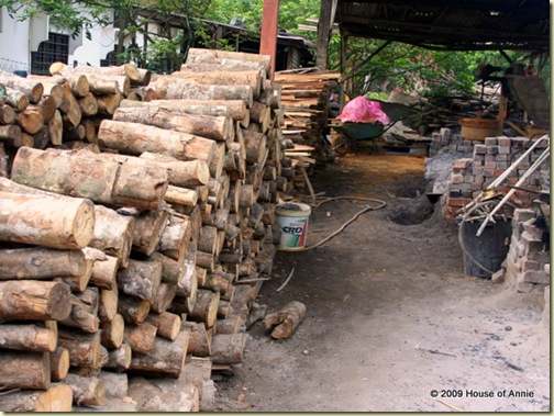 stacks of rubber tree logs