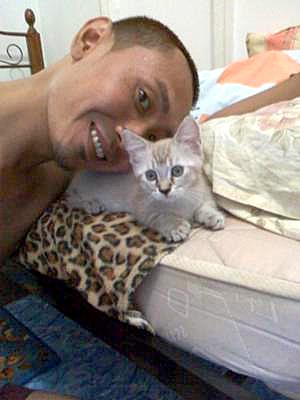 Munchkin cat and its owner Fendi