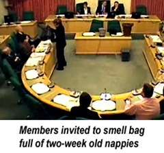 Bag full of two-week old nappies