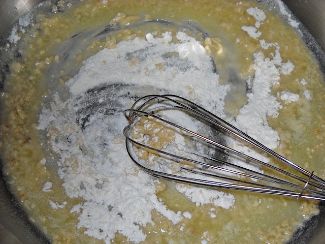 flour added to garlic and butter and mixed in 
