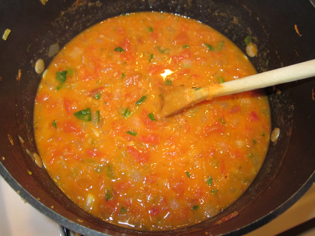 seasoning added to pot of soup 
