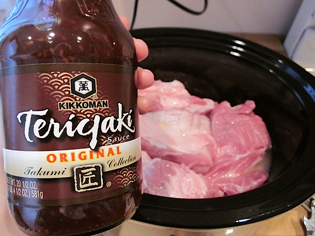 teriyaki sauce in bottle ready to pour into slow cooker 