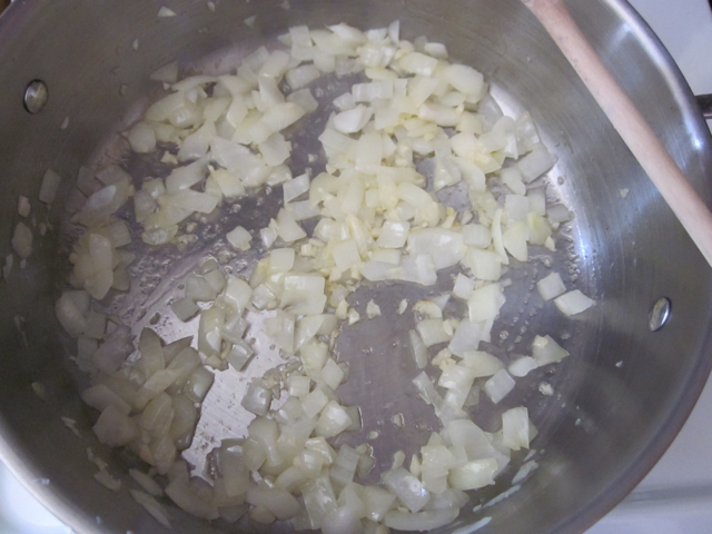 onion and garlic cooking in the soup pot