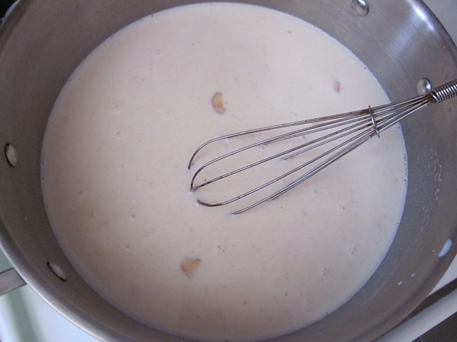 add milk to pot and whisk 