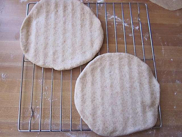 rolled out dough on cooling rack ready to cook 