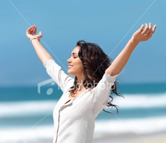 ist2_6244050-pretty-young-woman-with-arms-raised