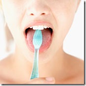 cleaning tongue with toothbrush