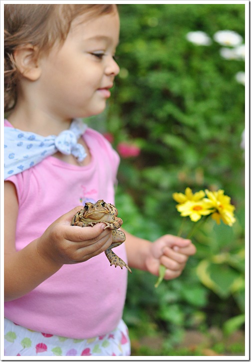 ella with toad and flowers