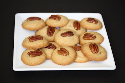 photo of pecan praline cookies on a white serving plate