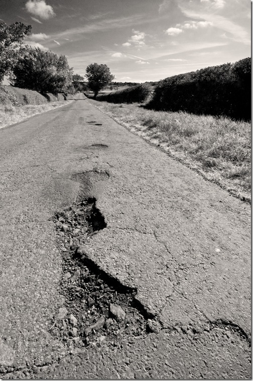 country lane with damaged tarmac