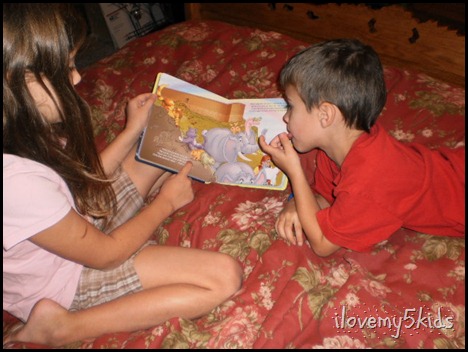 Sister reading to Brother