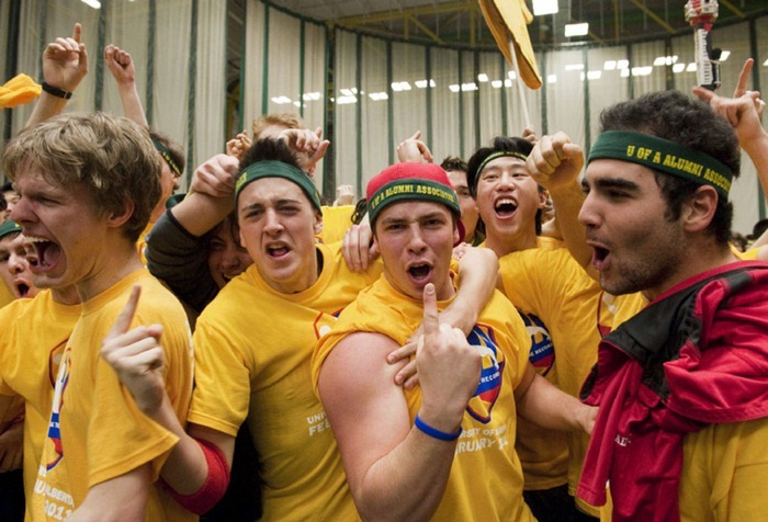 Team yellow celebrates after two thousand and twelve students try to reclaim the Guinness World Record for most people in a dodge ball game, in Edmonton, Alberta, on Friday, February 4, 2011. The record attempt at the Butterdome, Universiade Pavilion on the University of Alberta campus eclipsed the current record which was set by just over 1700 students.  THE CANADIAN PRESS/John Ulan