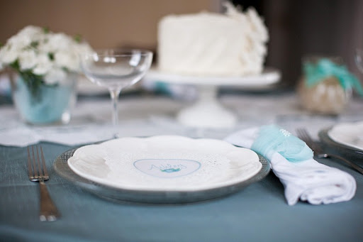 teal and brown table settings for a wedding