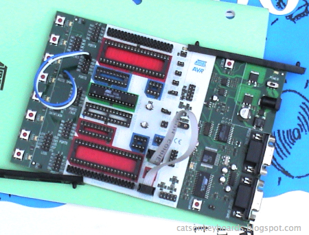 STK-500 board with rails along edge, showing the components are too close to the edge for the rails.