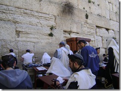 Men Praying At Wall