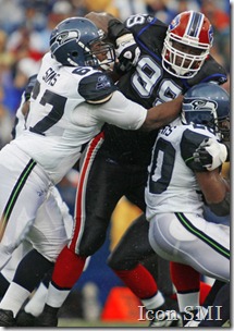 07 September 2008: Seattle Seahawks guard Rob Sims (67) tries to block for running back Maurice Morris (20), but is wrapped up by  Buffalo Bills defensive tackle Marcus Stroud (99) at Ralph Wilson Stadium in Orchard Park, NY.
  