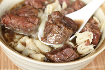 close-up photo of a bowl of beef noodle soup