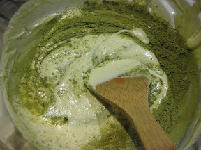 photo of the green tea powder being stirred into the cake