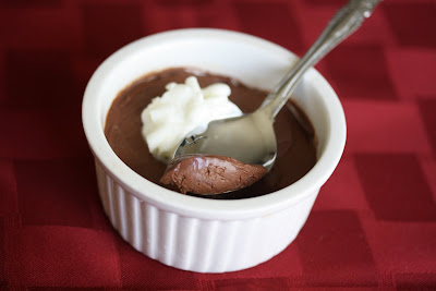 photo of one chocolate mousse with a spoon