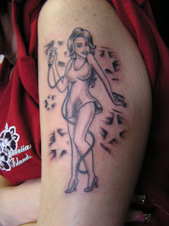 Tattoo pictures female singer in the arm, photos and image