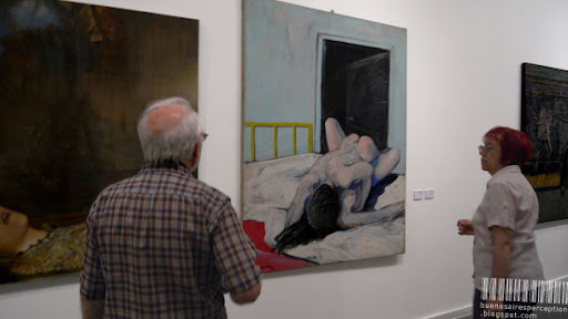 Couple in Front of a Coitus on Canvas by Pablo Suarez in the Centro Cultural Borges Buenos Aires, Argentina