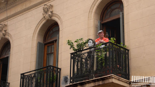 Portrait of a Gentleman with a Parrot standing on a Balcony in Buenos Aires, Argentina