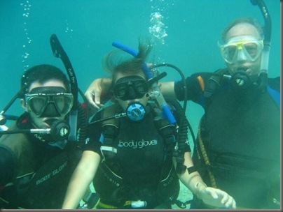 Stan, Emma and Steve pose underwater