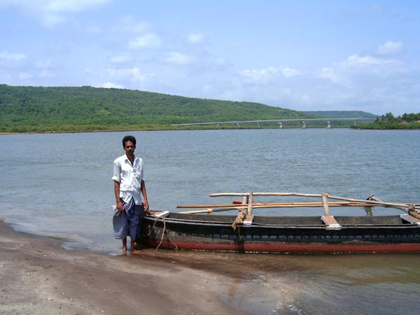 Boatman and his boat at Harne beach