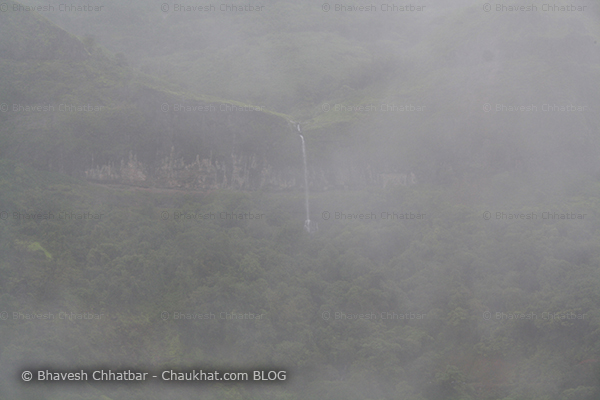 Dense mist due to monsoon clouds in Tamhini ghat waterfall