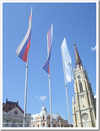 Crkva imena Marijinog with flags of Serbia, Vojvodina and Novi Sad