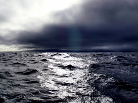Black Cloaked Woman. a lack cloaked horizon