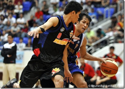 Kiko Adriano tightly guarded by a Patriot player.