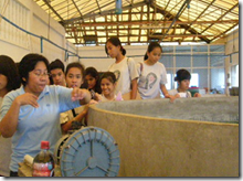 AQD Associate Researcher Ms. Antonietta Evangelista (leftmost) briefs students on BFS’ activities at the bighead carp hatchery