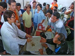 Dr. Catacutan demonstrates aquafeed formulation for the trainees