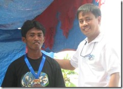 Mr. Abdul receives his medal for outstanding trainee from PDAP Executive Director Jerry E. Pacturan during the ceremony held last April 23, 2008
