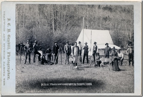 Title: [Engineers Corps camp and visitors]
Row of fifteen people and two deer in front of a tent. Some of the men are holding measuring poles and or standing next to surveyors' transits on tripods. 1889.
Repository: Library of Congress Prints and Photographs Division Washington, D.C. 20540