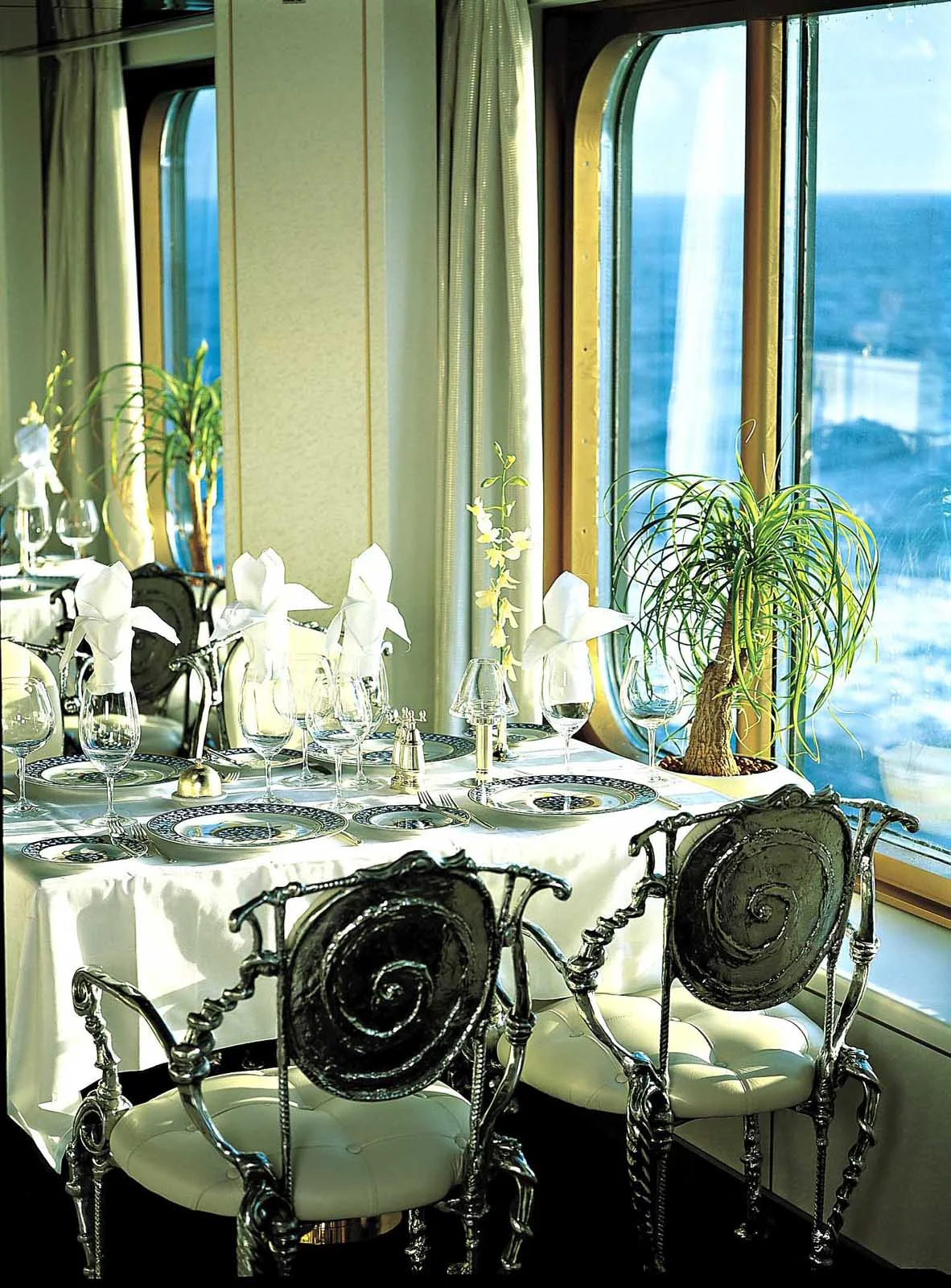 Holland-America-Vista-Class-Pinnacle-Grill - Head to the Pinnacle Grill during your Zuiderdam cruise for fine dining in a refined atmosphere — and a sumptuous view. 