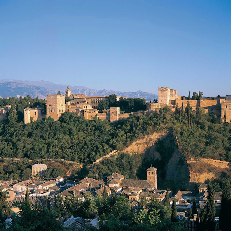 A scenic view of Alhambra, the historic royal palace and fortress — originally constructed in 889 and rebuilt in the mid-11th century — in the city of Granada in the Andalusia region of southern Spain.