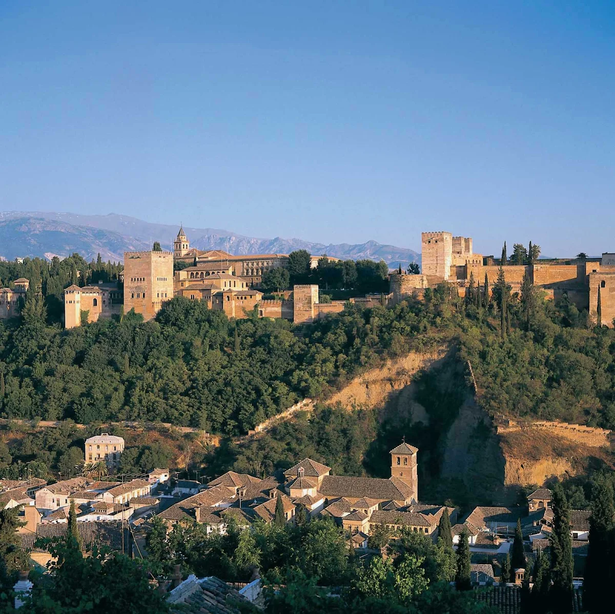 Alhambra-landscape-Spain - A scenic view of Alhambra, the historic royal palace and fortress — originally constructed in 889 and rebuilt in the mid-11th century — in the city of Granada in the Andalusia region of southern Spain.