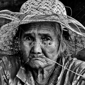 Grass in the mouth by Rafael Widya Wiryawan - People Portraits of Women