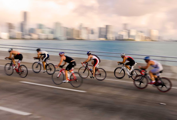 Cyclists race across a causeway in Key Biscayne, Florida.